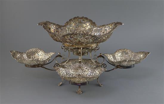 An Edwardian pierced silver epergne by James Dixon & Sons, Sheffield, 1902, with one large and four smaller baskets, 56 oz.